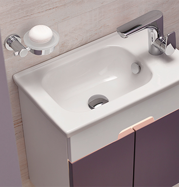 Close up of VitrA D-Light purple compact washbasin unit with wall-mounted soap holder